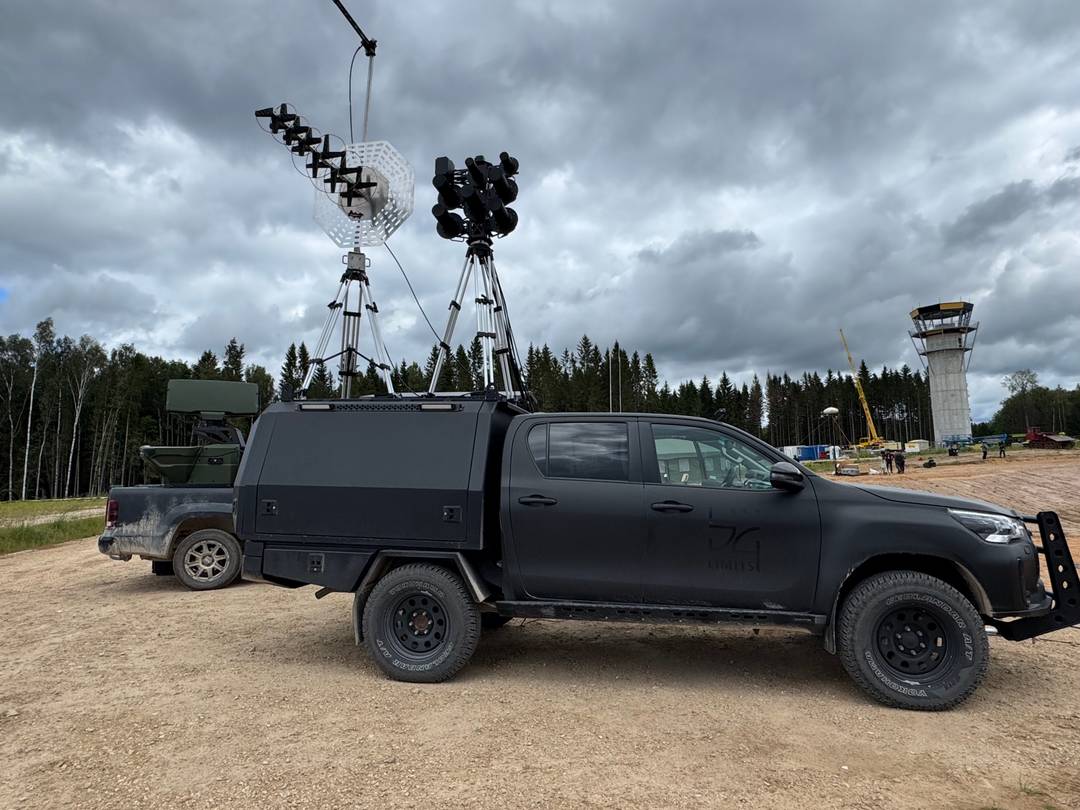 Defender reactive jamming system deployed on vehicle with directional antennas and mast — field operational configuration
